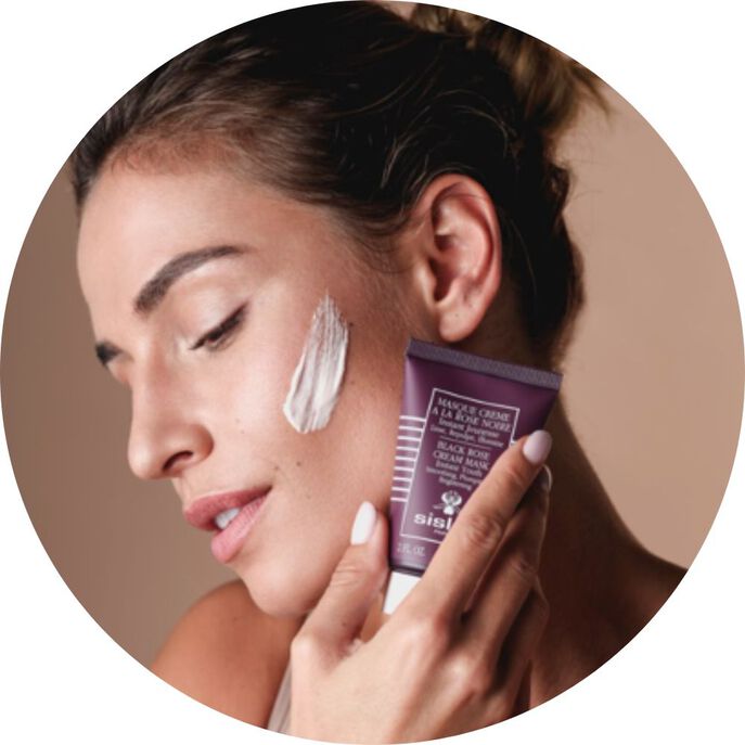 Woman showing the Black Rose Cream Mask